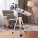 Telescope with tripod on a white background