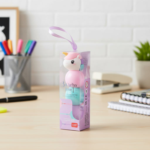 3 in 1 Highlighter Unicorn shaped toy with a pink and blue design in a clear packaging box on a desk