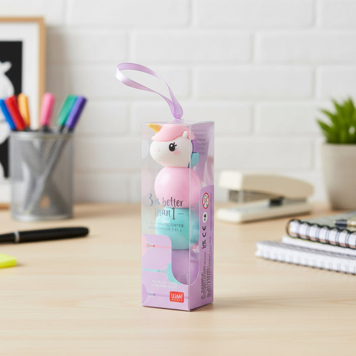 3 in 1 Highlighter Unicorn shaped toy with a pink and blue design in a clear packaging box on a desk
