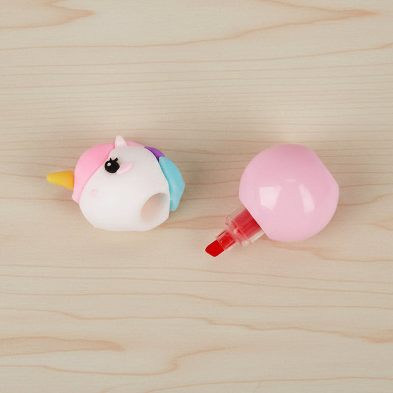 Unicorn-shaped bottle cap on a wooden surface