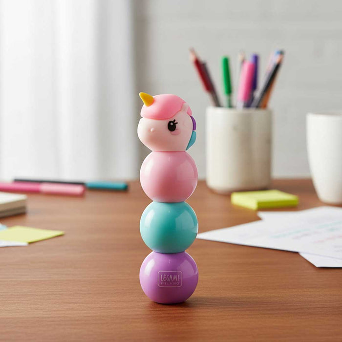 3 in 1 Highlighter Unicorn shaped toy with a pink and blue design in a clear packaging box on a desk