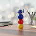 3-in-1 Highlighter Colorful toy figure on a desk with a blurred office background