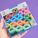 IQ Noodles game packaging held by a hand with a purple background