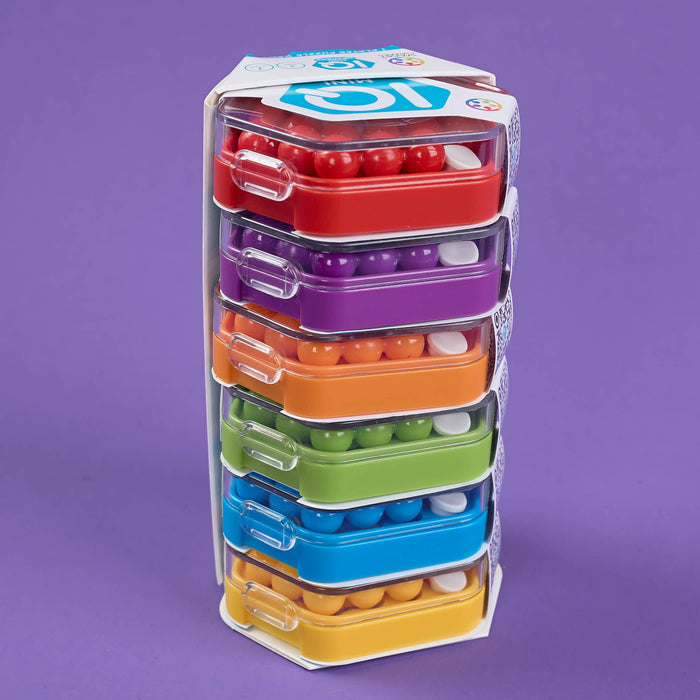 Set of colorful plastic containers stacked in a tower on a purple background