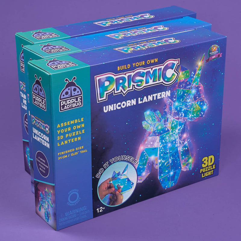 Box of 'Build Your Own Prismic Unicorn Lantern' on a purple background