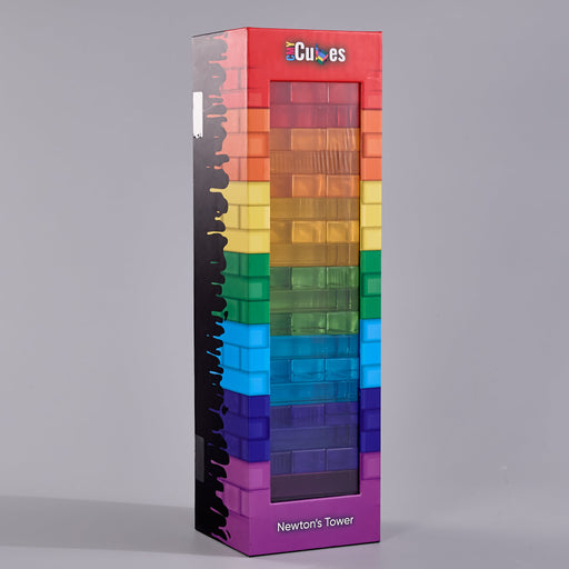 A tall rectangular retail box for a toy block game called Newton's Tower, with a rainbow-colored front window showing stacked translucent blocks. The box has a red top, purple bottom, black side panel, and the visible brand name 'CMY Cubes' at the top.