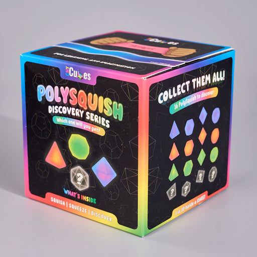 A boxed product called Polysquish Discovery Series by Cubes, shown at a three-quarter angle on a light gray studio background. The box is black with bright neon rainbow borders and colorful geometric illustrations, including a triangle, hexagon, square, and diamond.