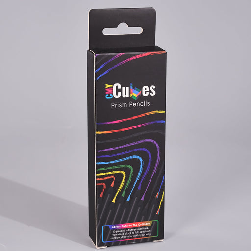 A black retail box for 'Cubes Prism Pencils' with colorful rainbow line graphics and a hanging tab at the top, photographed on a light gray studio background.