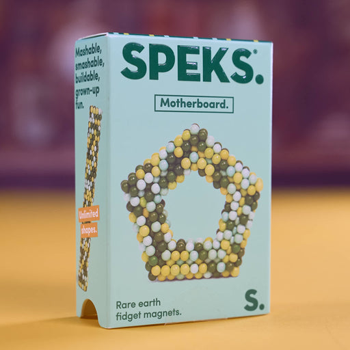A box of SPEKS. Motherboard rare earth fidget magnets, size S, featuring a light blue-green box with a graphic of a pentagonal magnetic structure made of green, yellow, and white beads.