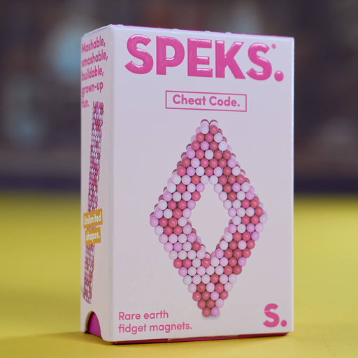 A pink and white box of SPEKS. 'Cheat Code.