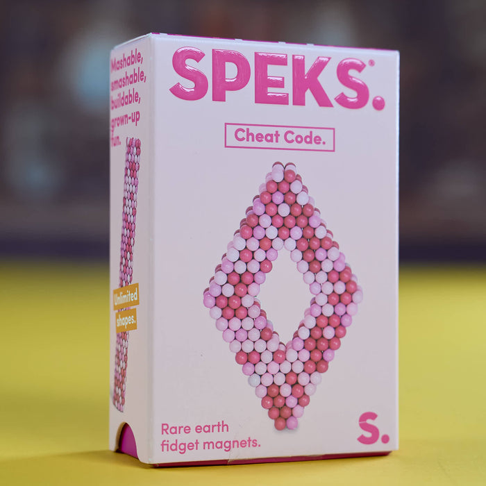 A pink and white box of SPEKS. 'Cheat Code.