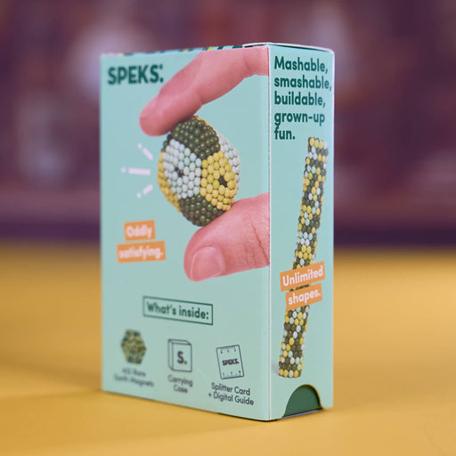 A light blue box of SPEKS. Mashable, smashable, buildable, grown-up fun.