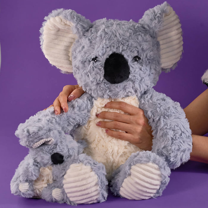Grey koala plush toy, soft fluffy texture, cream belly and inner ears, large black nose, cute cuddly design