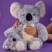 Grey koala plush toy, soft fluffy texture, cream belly and inner ears, large black nose, cute cuddly design