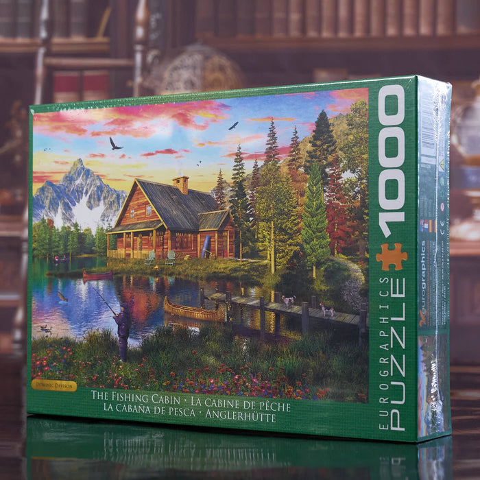 Eurographics puzzle Jigsaw puzzle box featuring a scenic cabin by a lake with mountains in the background.