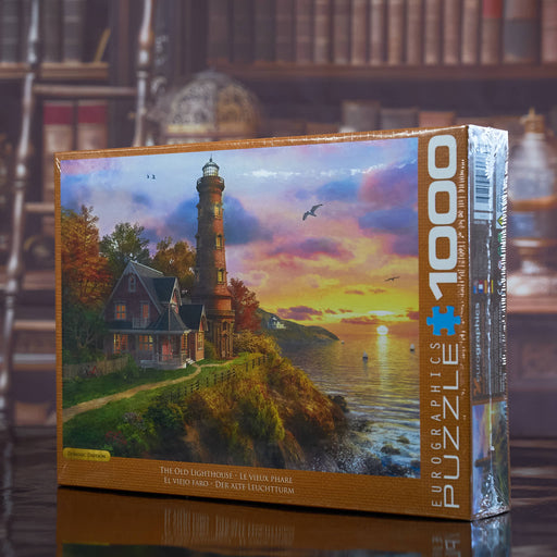 EUROGRAPHICS PUZZLE Jigsaw puzzle box with a lighthouse scene on a bookshelf background
