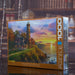 EUROGRAPHICS PUZZLE Jigsaw puzzle box with a lighthouse scene on a bookshelf background