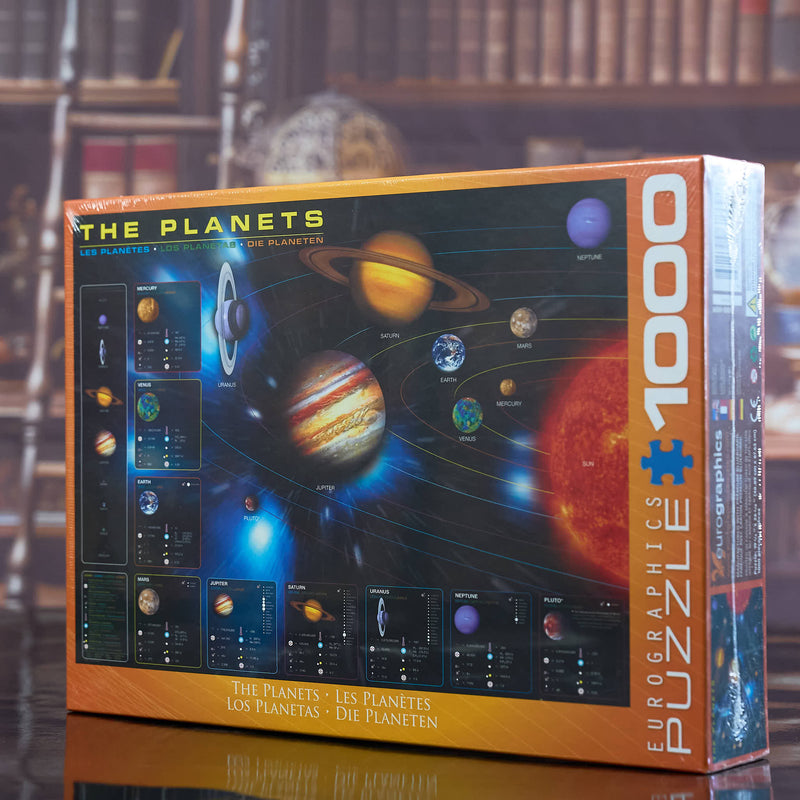 Puzzle box titled 'The Planets' by Eurographics on a reflective surface with a blurred bookshelf background.