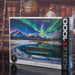 EUROGRAPHICS Jigsaw puzzle box featuring a scenic Aurora Borealis over mountains and lake with a bench.