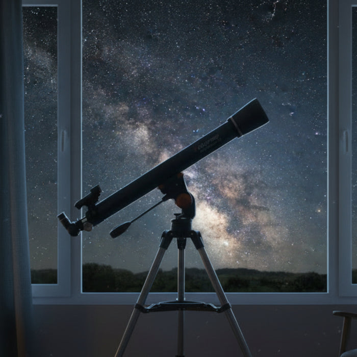 Celestron telescope with accessories on a gray background