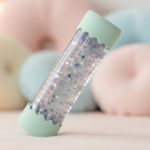 Clear calm down bottle with glittery stars and green lid 