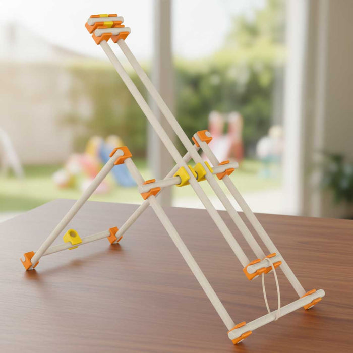 Toy structure made of interlocking pieces on a wooden surface with a blurred outdoor background