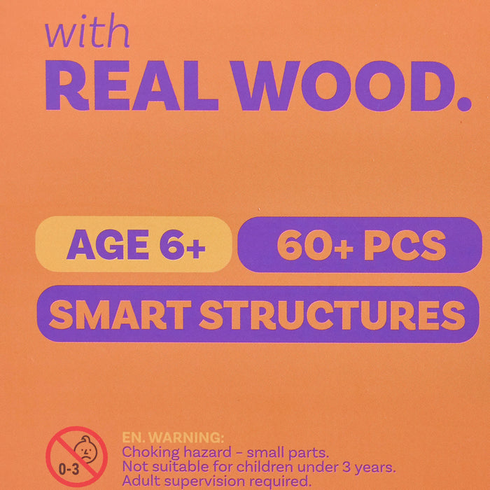 Promotional graphic on an orange background with purple and yellow text reading 'with REAL WOOD.', 'AGE 6+', '60+ PCS', and 'SMART STRUCTURES', plus a choking-hazard warning icon and age 0-3 mark.