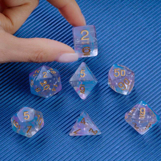 Blue and Purple Resin Polyhedral Dice Set held
