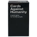 Black box of 'Cards Against Humanity' game with white text on a white background