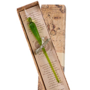 Green glass pen with silver clip in a decorative box featuring vintage map design.