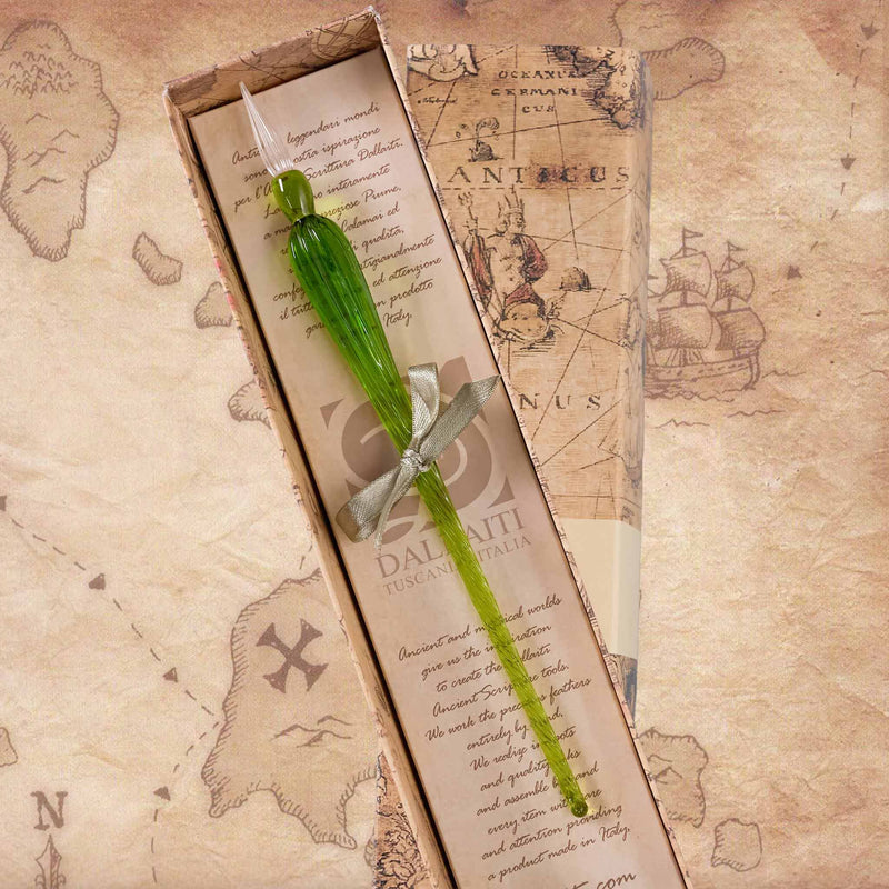 Green glass pen with silver clip in a box on a vintage map background