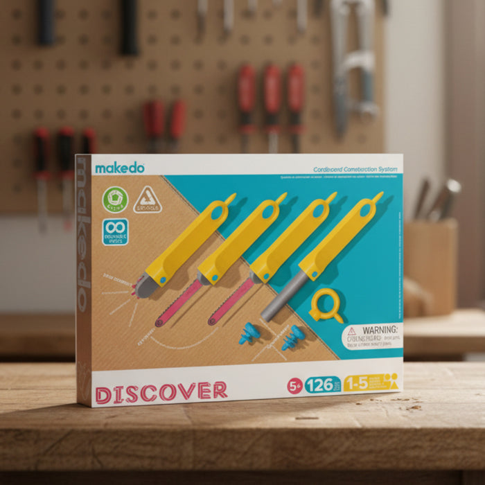 Packaging for 'Discover Upcycled Cardboard 126 pcs' featuring various yellow cardboard construction tools and the Makedo logo.