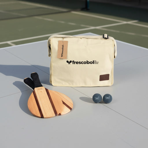 Frescobol paddle and ball set with a beige carrying case on a white background