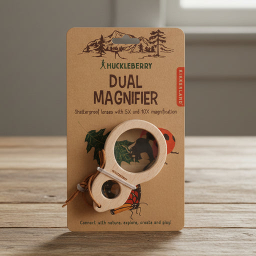 Huckleberry dual magnifier on a brown packaging with nature-themed illustrations.