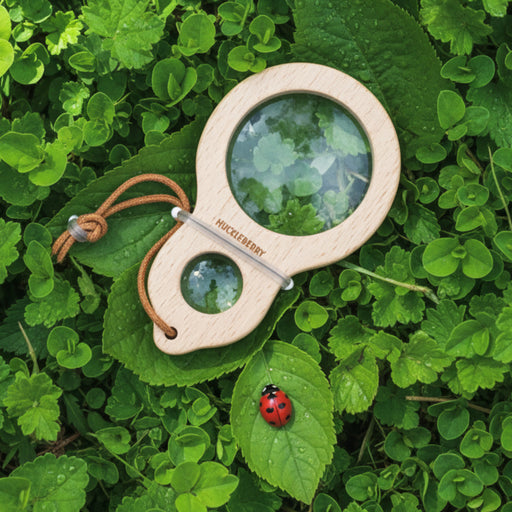 Huckleberry dual magnifier on a brown packaging with nature