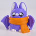 A cute 3D-printed bat plush toy in purple with a bright orange scarf, set against a clean white background.