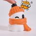 click A 3D-printed cute ghost figurine wearing an orange knit beanie with a white pom-pom and an orange scarf, set against a plain light gray background.