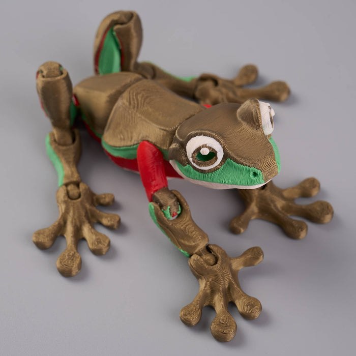 Plush toy frog with a red tongue on a gray background