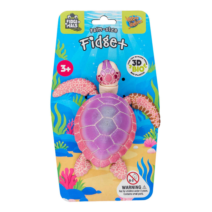 Package of a pink turtle-shaped fidget toy with ocean-themed design