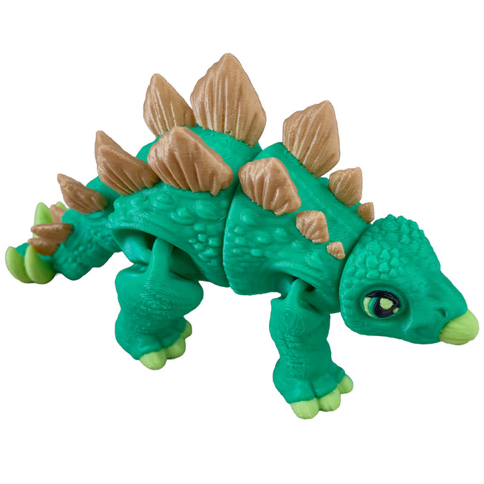 Toy dinosaur figure with green body and brown spikes on a white background