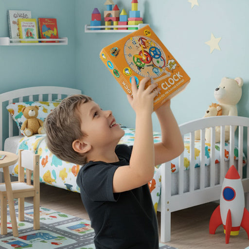 Child holding a DIY clock in a colorful bedroom with toys and furniture.