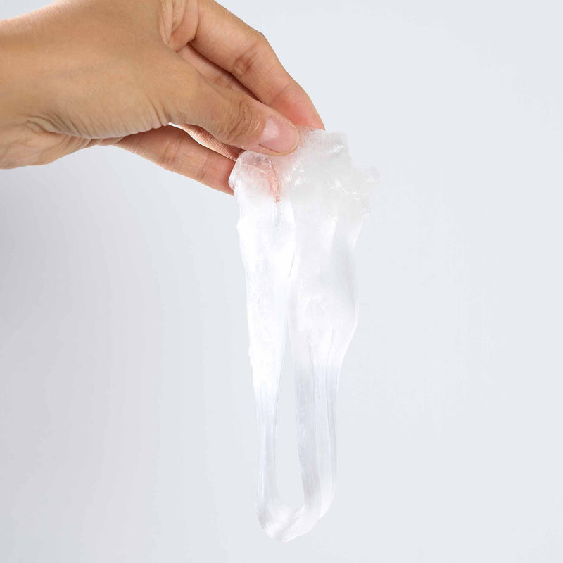 Hand holding a clear plastic putty against a white background