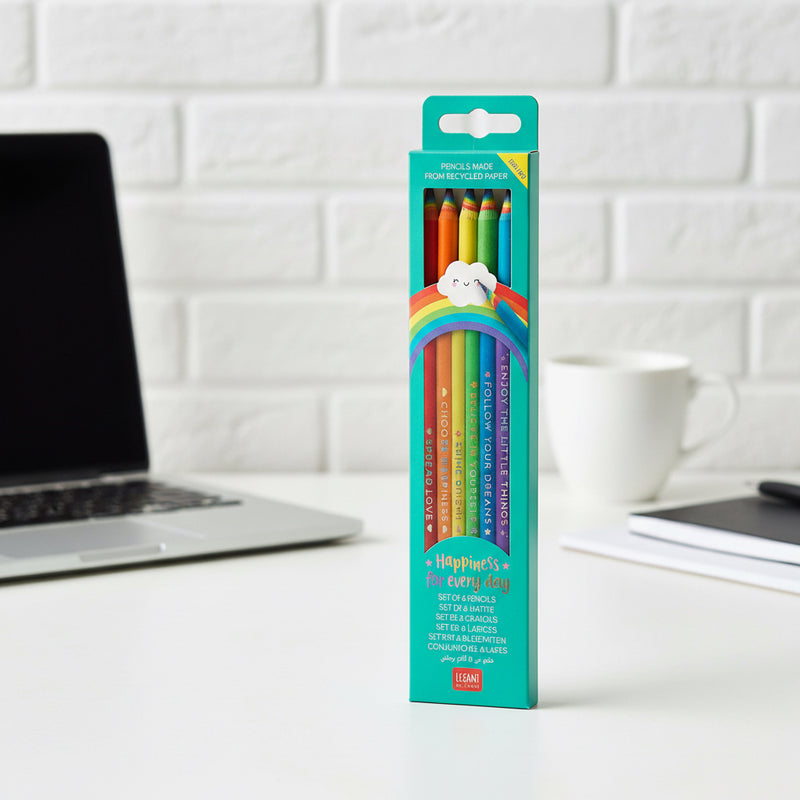 Pack of colorful pencils in a teal box with a rainbow design on a white desktop background