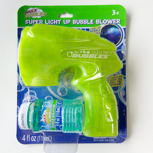 Maxx Bubbles Super Light Up Bubble Blower packaging with green bubble gun and solution bottle on a white background