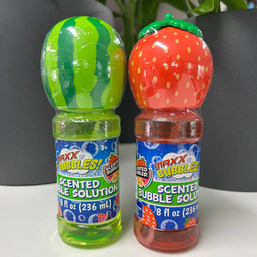 Two bottles of Maxx Bubbles scented bubble solution, one watermelon and one strawberry, on a white surface.