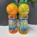 Two bottles of Maxx Bubbles scented bubble solution, one with an orange top and one with a pineapple top, on a white surface.