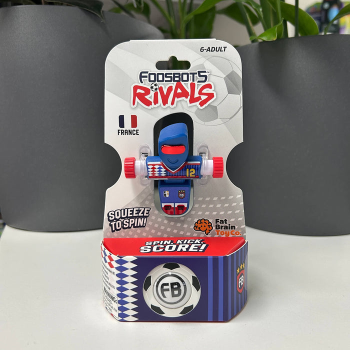 Package of 'FOOSBOTS RIVALS' toy with a blue and red robot figure on a white surface.