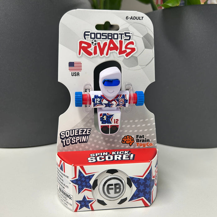 USA Toy figure in packaging with 'Foodsbots Rivals' branding on a gray background