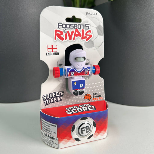 Package of a toy figure with 'Foodsbots Rivals'  OF ENGLAND branding on a gray background