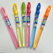 Five colorful bubble wands with labeled caps on a white background